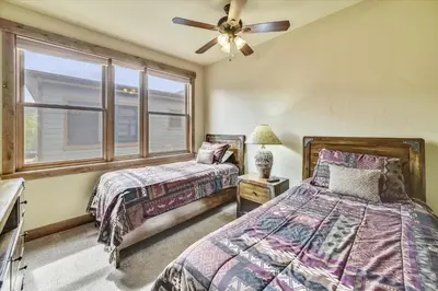 a bedroom with two beds and a window at Apartments Off Main #4 in Frisco