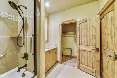 a bathroom with a shower and a shower stall at Apartments Off Main #4 in Frisco