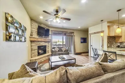 a living room with a couch and a fireplace at Apartments Off Main #4 in Frisco