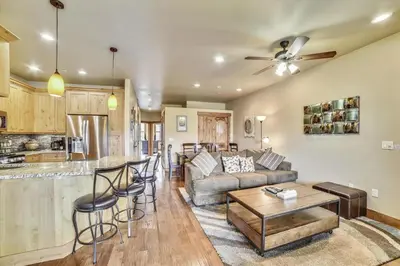 a living room with a couch and a table at Apartments Off Main #4 in Frisco