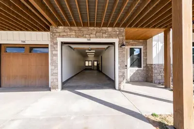 an empty garage with a wooden ceiling at Zephyr Escape in Fraser