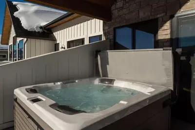 a jacuzzi tub with water in it in a house at Zephyr Escape in Fraser