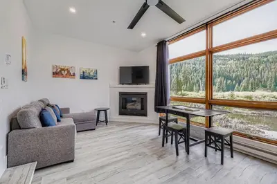 a living room with a couch and a table at 2903 Riverbank Lodge condo in Keystone