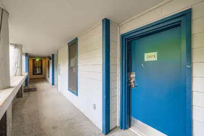 a blue door on the side of a building at 2903 Riverbank Lodge condo in Keystone
