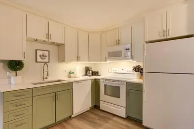 a kitchen with white appliances and a white refrigerator at Close to Rocky Mtn Slopes! Cozy Silverthorne Condo in Silverthorne