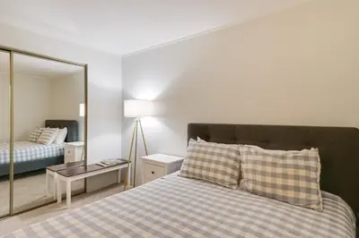 a bedroom with a bed with a large mirror at Close to Rocky Mtn Slopes! Cozy Silverthorne Condo in Silverthorne