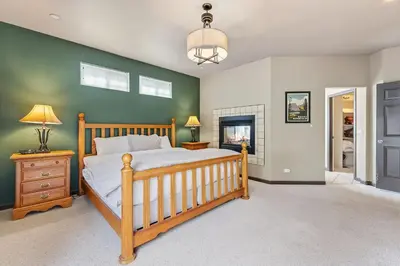 a bedroom with a bed and a green wall at Dog Friendly Stay Near Trails in Silverthorne in Silverthorne