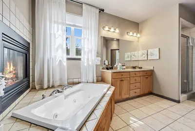 a large bathroom with a tub and a window at Dog Friendly Stay Near Trails in Silverthorne in Silverthorne