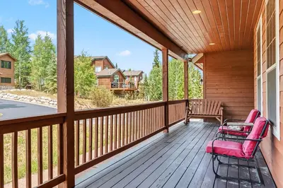 a screened porch with two chairs and a table at Dog Friendly Stay Near Trails in Silverthorne in Silverthorne
