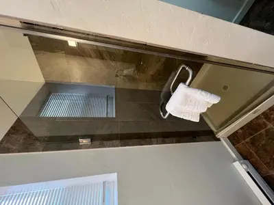 a towel dispenser on top of a kitchen counter at Railway Cabin at Base Camp in Dumont