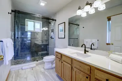 a bathroom with a shower and a sink and a toilet at 122 Lookout Ridge townhouse in Dillon
