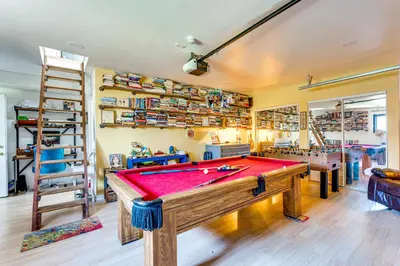 a room with a pool table and shelves at Trail Access, Hot Tub Lakefront Boulder Retreat! in Boulder