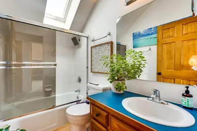a bathroom with a sink and a toilet and a shower at Trail Access, Hot Tub Lakefront Boulder Retreat! in Boulder