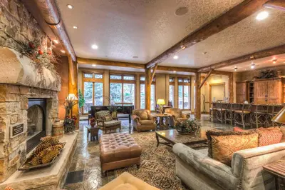 a large living room with a stone fireplace at Timbers 3074 in Keystone
