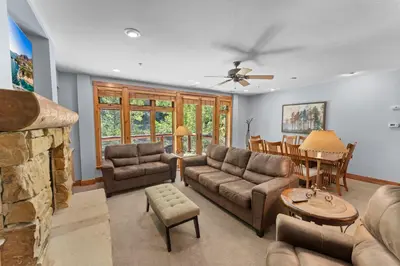 a living room with a couch and a table at Timbers 3074 in Keystone