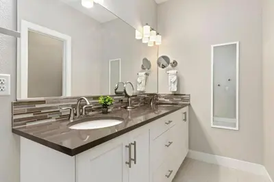 a bathroom with a sink and a mirror at Rams Roost with Rooftop Hot Tub, Patio and Family Fun in Fort Collins