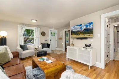 a living room with a couch and a table at Shade Tree Bungalow in Old Town, Yard & Garage in Fort Collins