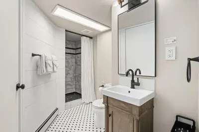 a bathroom with a sink and a toilet at Shade Tree Bungalow in Old Town, Yard & Garage in Fort Collins