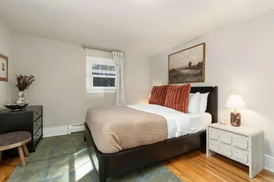 a bedroom with a large bed and a window at Shade Tree Bungalow in Old Town, Yard & Garage in Fort Collins