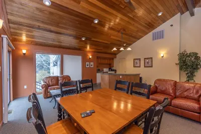 a living room with a table and a couch at Lake Cliffe 108 Building F in Dillon