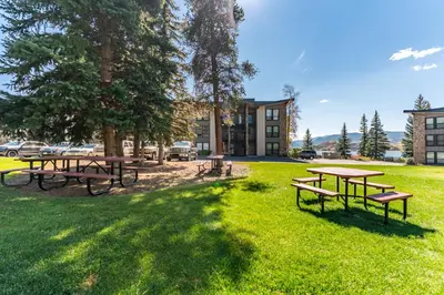 a group of picnic tables in a park at Lake Cliffe 108 Building F in Dillon
