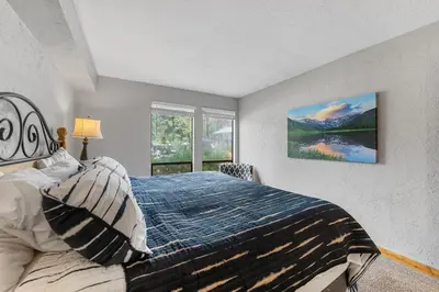 a bedroom with a bed and a window at Lake Cliffe 108 Building F in Dillon