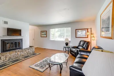 a living room with a couch and a fireplace at 2 Mi to Hospitals Home with Private Yard in Aurora in Aurora