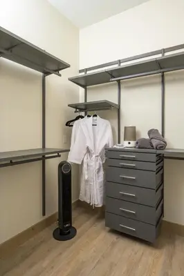 a room with shelves and a desk with a dresser at Lodge 212 Brand New LUXE Designer Home and Hot Tub in Fraser