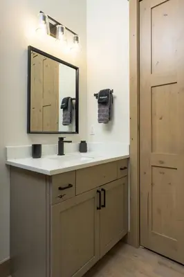 a bathroom with a sink and a mirror at Lodge 212 Brand New LUXE Designer Home and Hot Tub in Fraser
