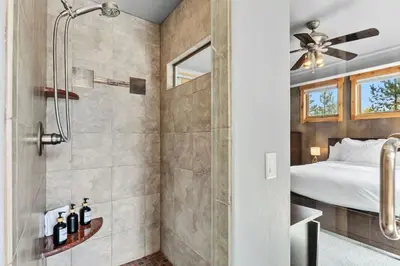 a master bathroom with a shower and a bed at Mountain Getaway Deck Spacious Kitchen in Silverthorne
