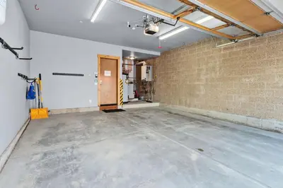 an empty room with a brick wall at Mountain Getaway Deck Spacious Kitchen in Silverthorne