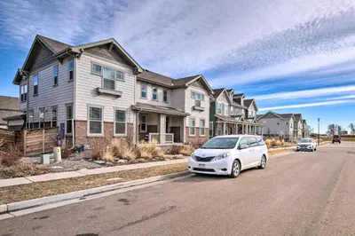 a white car parked in front of a house at Charming 3BR Retreat - Perfect for Families in Fort Collins