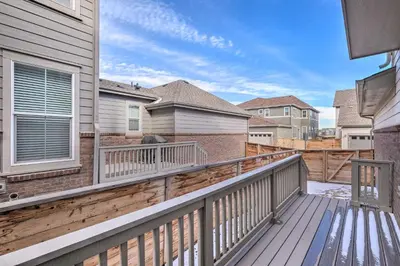 a balcony of a house with a wooden deck at Charming 3BR Retreat - Perfect for Families in Fort Collins