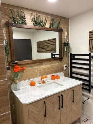 a bathroom with a sink and a mirror at The Cozy nest in Englewood