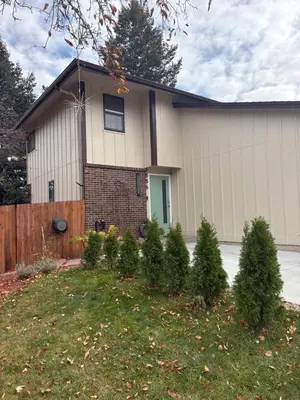 a house with christmas trees in front of it at The Cozy nest in Englewood