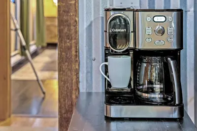 a coffee maker sitting on a counter with a cup at Dog Friendly, Year Round, Creekside Cabin, Hot Tub, 6 Acres in Jamestown