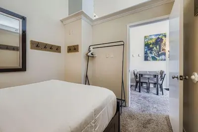 a bedroom with a bed and a table at 2795 Slopeside condo in Keystone
