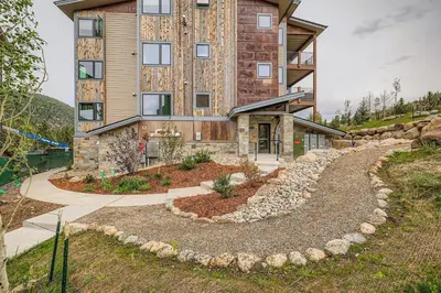 aominium building with a garden in front of it at 305 Brightwood at Keystone condo in Keystone