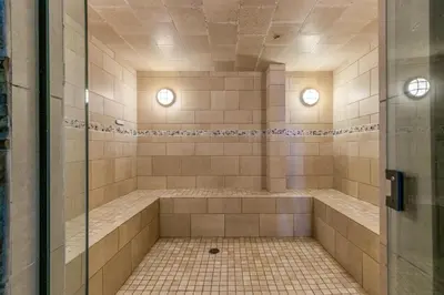 a bathroom with a shower with a tiled floor at 305 Brightwood at Keystone condo in Keystone