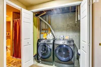 a laundry room with a washer and dryer at Spacious Family Home with Deck and Yard in Littleton! in Littleton
