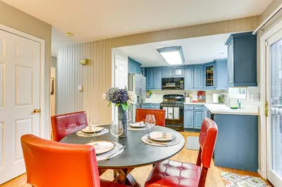a kitchen and dining room with a table and chairs at Spacious Family Home with Deck and Yard in Littleton! in Littleton