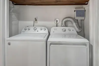 a kitchen with a stove and a washer and dryer at Keystone Mtn Getaway - Cozy Condo for 4 in Keystone