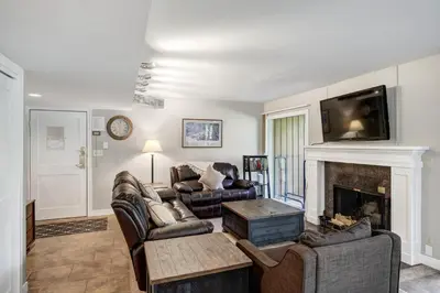 a living room with two couches and a fireplace at Keystone Mtn Getaway - Cozy Condo for 4 in Keystone