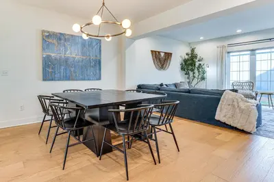a living room with a table and chairs and a couch at Family Haven, Walk to Dtwn Erie Bring Your Pets! in Erie