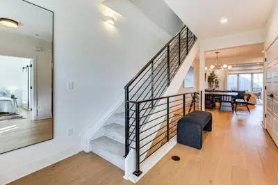 a staircase in a house with a dining room at Family Haven, Walk to Dtwn Erie Bring Your Pets! in Erie