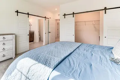 a bedroom with a bed and a closet at Family Haven, Walk to Dtwn Erie Bring Your Pets! in Erie