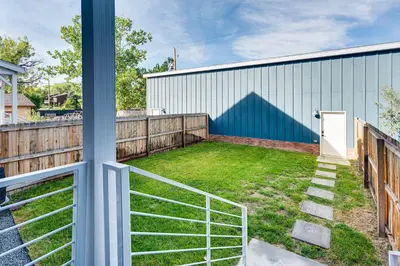 a backyard with a lawn and a fence at Family Haven, Walk to Dtwn Erie Bring Your Pets! in Erie