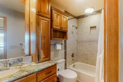 a bathroom with a sink and a toilet and a tub at Timber Ridge Escape in Silverthorne