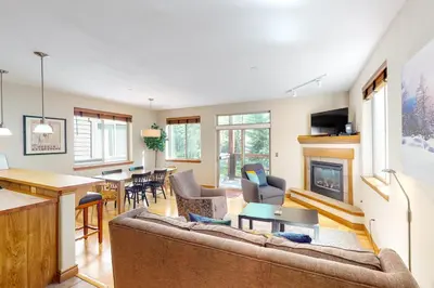a living room with a couch and a fireplace at Blue River Bliss in Silverthorne