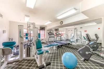 a fitness room with treadmills and machines at Gateway 5059 in Keystone